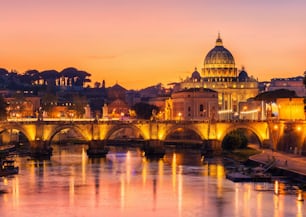 Rome Skyline with Vatican St Peter Basilica and St Angelo Bridge crossing Tiber River in city center of Rome Italy , historical landmarks attraction of the Ancient Rome , travel destination of Italy.