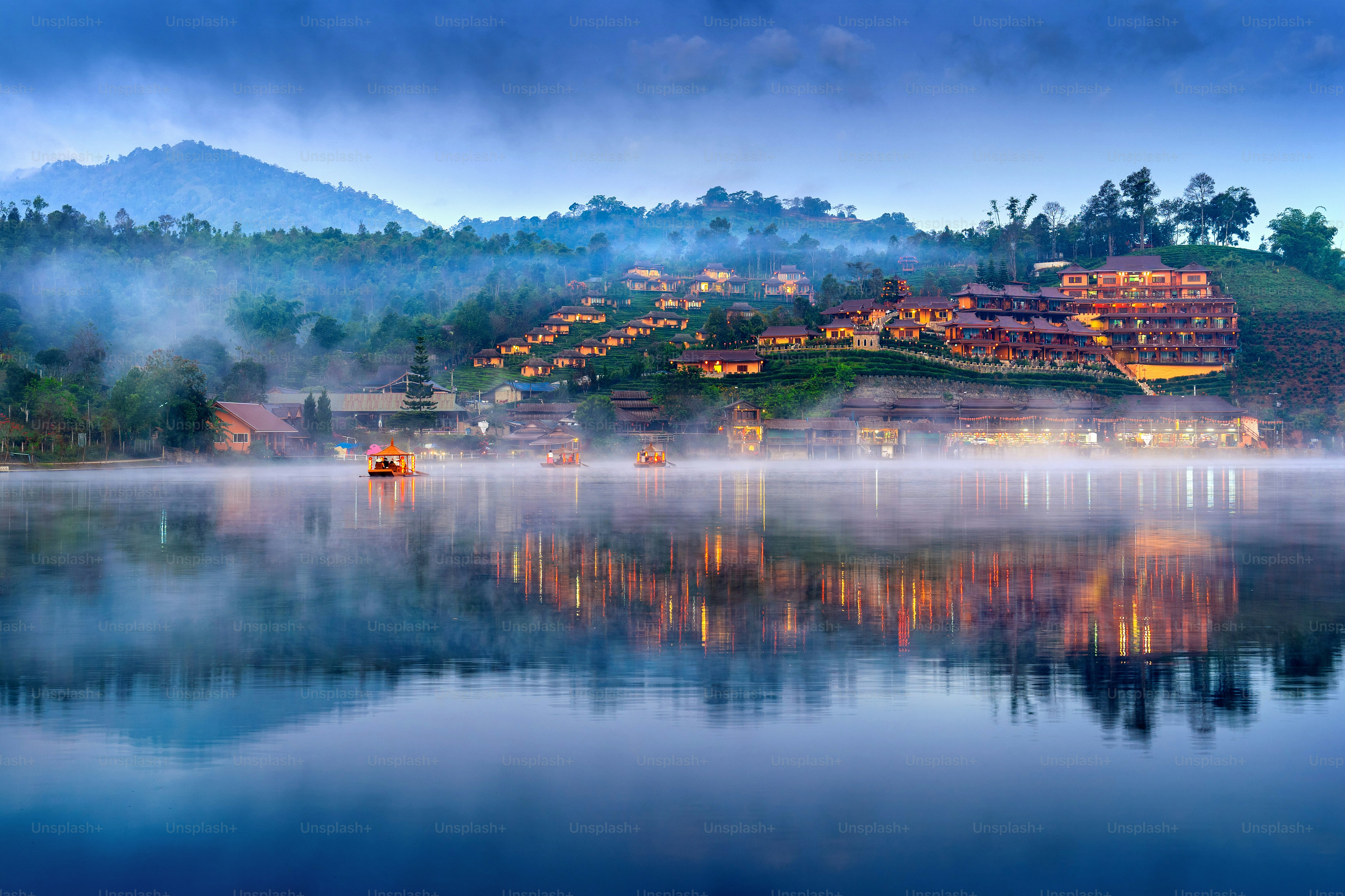 Tourists take a boat at Ban Rak Thai village in Mae Hong Son province, Thailand.