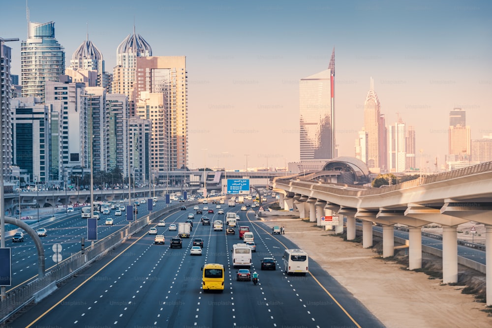 Aerial view of the famous Sheikh Zayed Road with car traffic and metro rails and numerous skyscrapers in Dubai Marina area