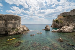 Old harbor of Dubrovnik old town, Croatia with Fort Lovrijenac (St. Lawrence Fortress) and Bokar Fort on a steep cliff in Dubrovnik old town, Croatia.