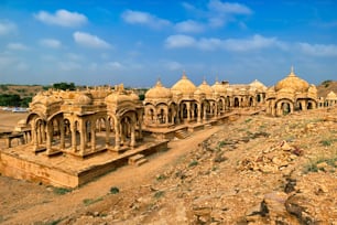 Tourist attraction and Rajasthan landmark - Bada Bagh cenotaphs (Hindu tomb mausoleum) made of sandstone in Indian Thar desert. Jaisalmer, Rajasthan, India