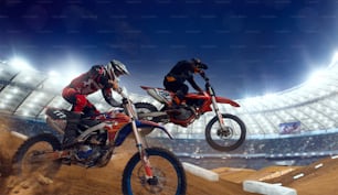 Motocross riders in action. Supercross. Motocross sport.