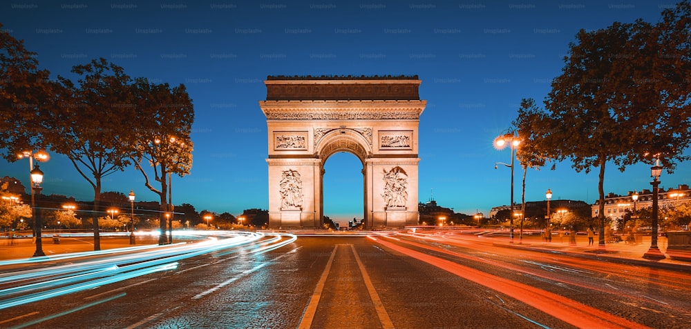 Famous Arc de Triomphe at night, Paris, France.