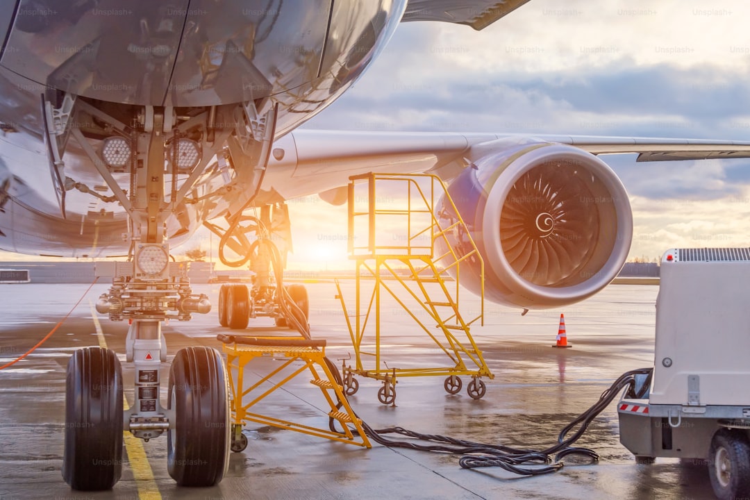 The front landing gear and auxiliary power installation to ensure autonomous power supply of the aircraft, in the backgr