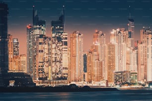 Night cityscape view of various skyscrapers. Real Estate and residential building concept