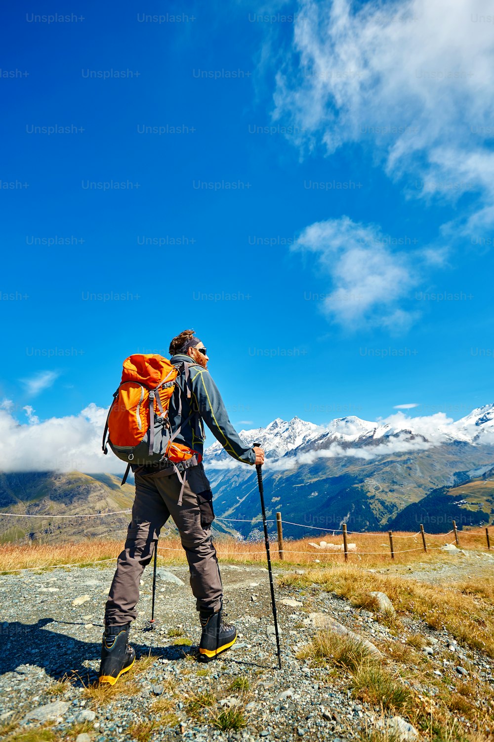 hiker in the Apls mountains. Trek near Matterhorn mount