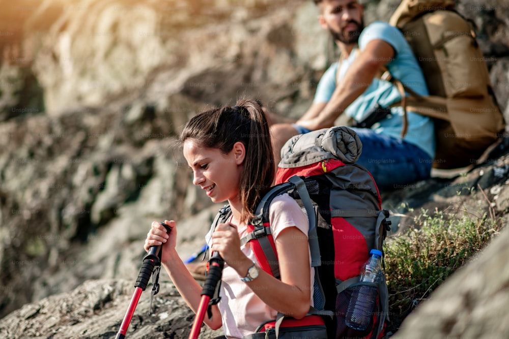 Hikers with backpacks climbing through mountain.Hiking, people,tourism and lifestyle concept.