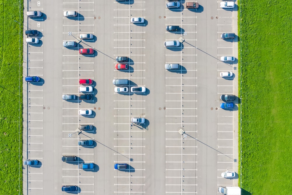 Open air half-empty parking for residents of the area, top aerial view from high