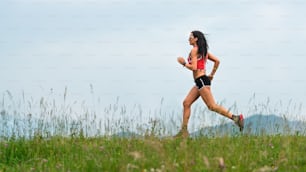 Woman runner during the preparation of a long distance trail