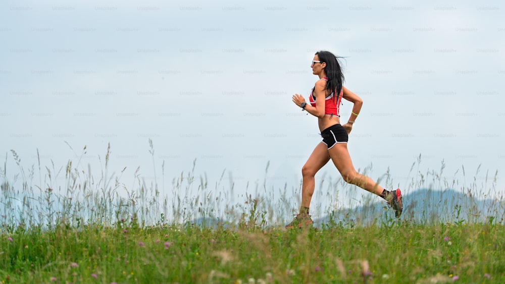 Woman runner during the preparation of a long distance trail