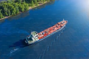 Aerial view tanker ship with liquid bulk cargo is sailing in channel water