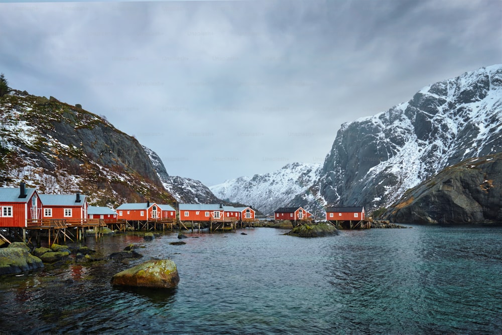 Nusfjord authentic fishing village with traditional red rorbu houses in winter. Lofoten islands, Norway