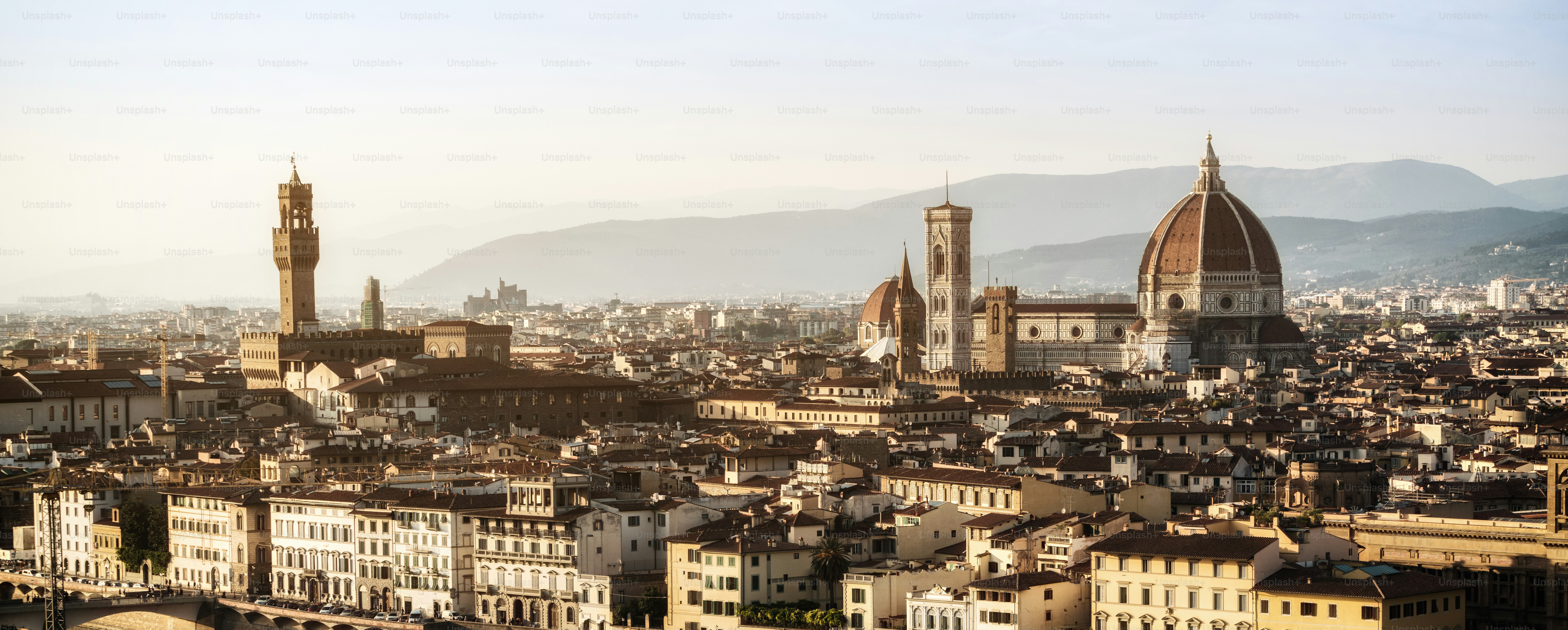 Florence Cathedral (Cattedrale di Santa Maria del Fiore) in historic center of Florence, Italy with panoramic view of the city. Florence Cathedral is the major tourist attraction of Tuscany, Italy.