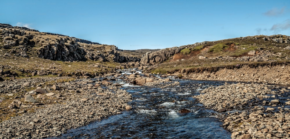 Shallow river stream nature terrain in countryside. Four-wheel drive vehicle track.