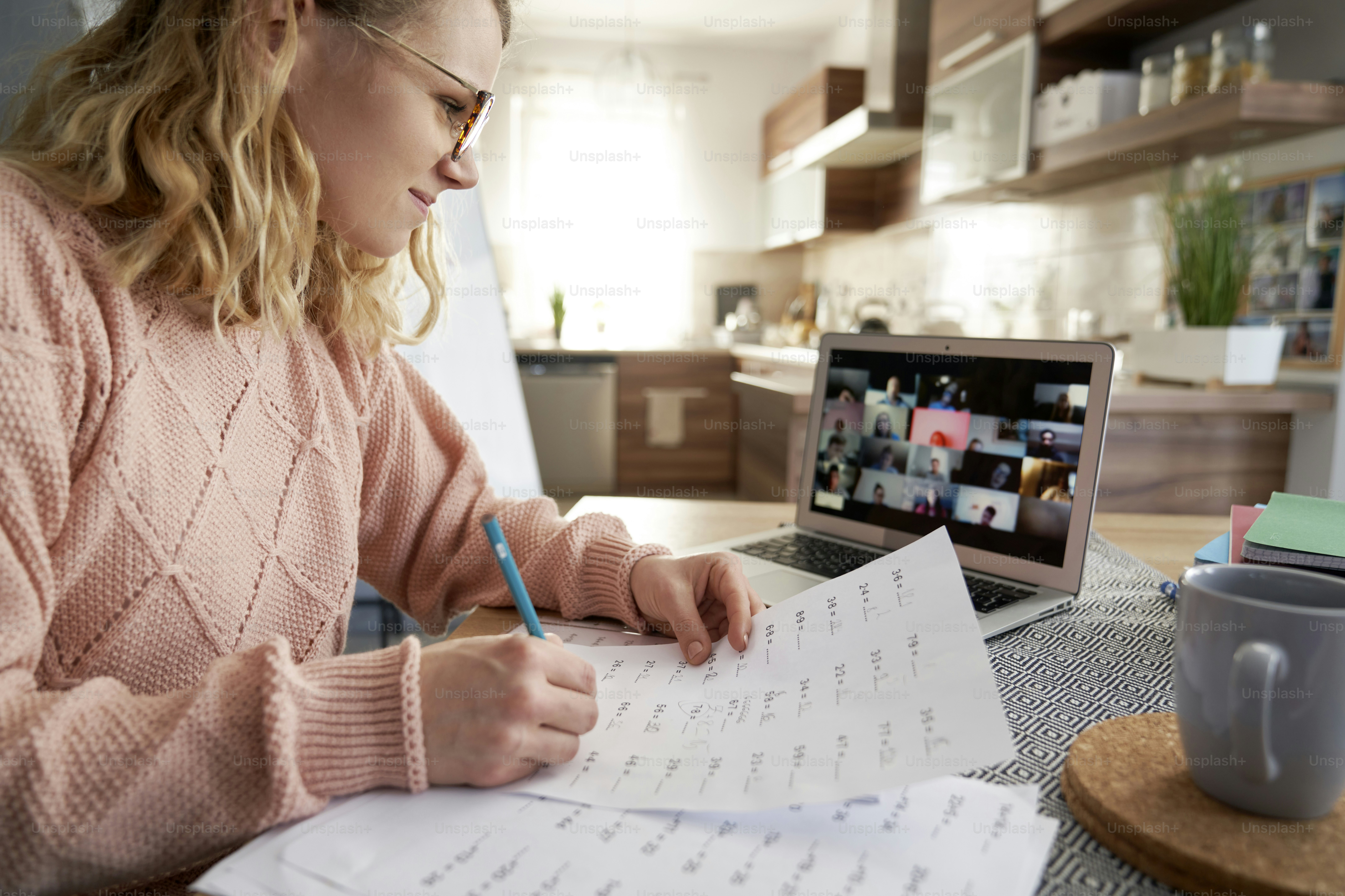 Smiling female teacher teaching remotely