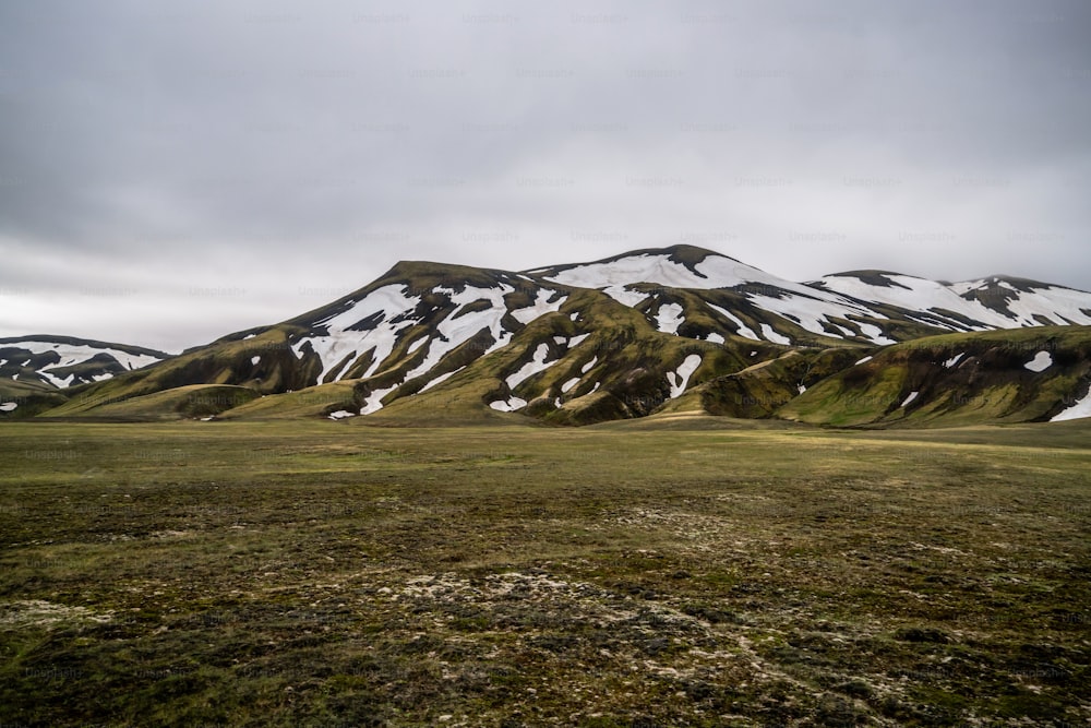 Landscape of Landmannalaugar surreal nature scenery in highland of Iceland, Nordic, Europe. Beautiful colorful snow mountain terrain famous for summer trekking adventure and outdoor walking.