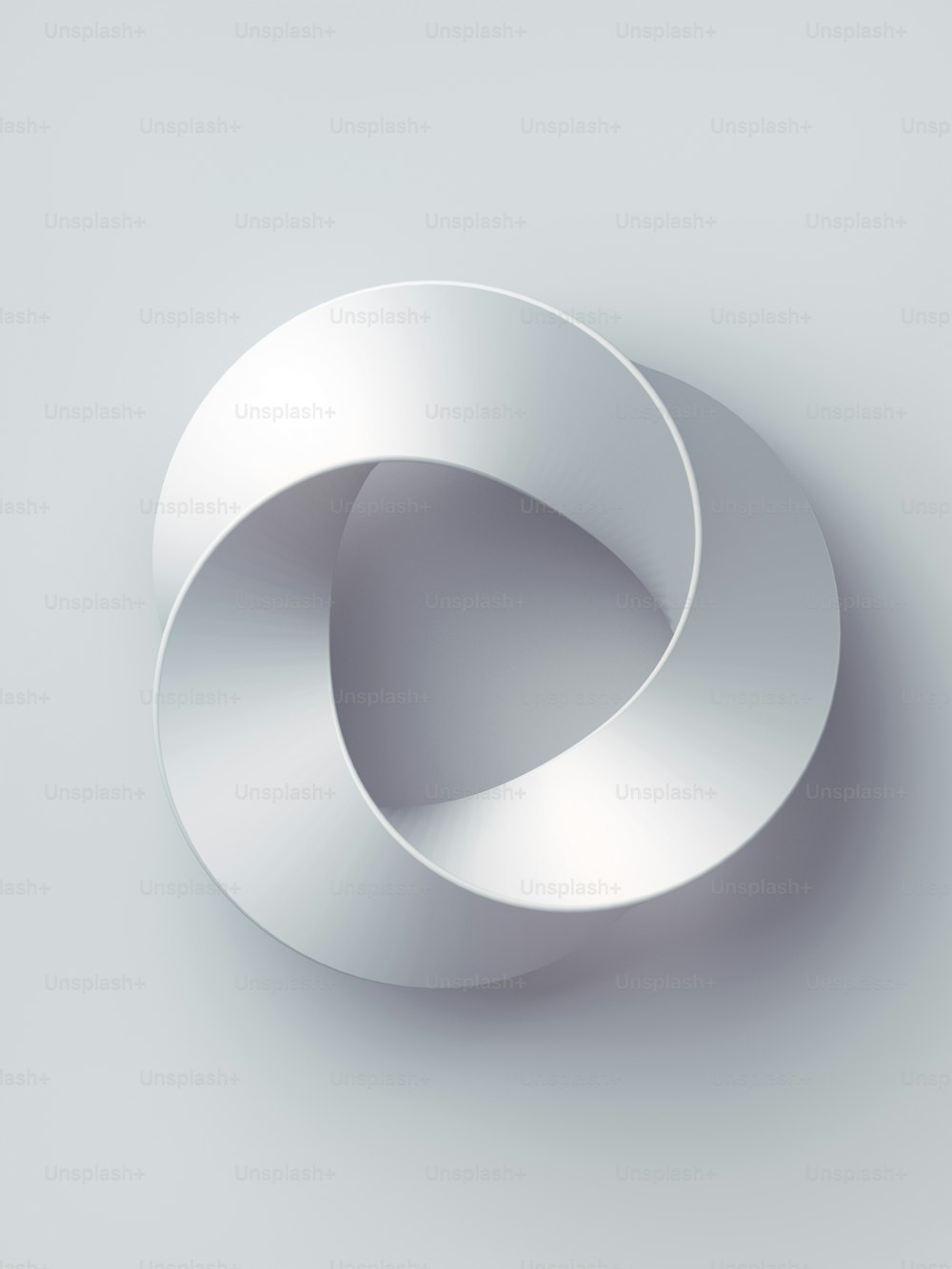 メビウスの帯の指輪の神聖幾何学。上向きのサーフェスを持つ空間図形。白い背景に3Dレンダリングカバーデザイン。ミニマルアート、抽象的なデジタルイラストレーション