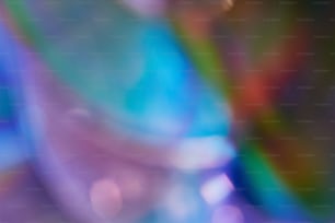 Defocused film texture background with colored lights on dark background. Blurred rainbow color light flare for photo effects