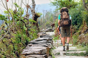 hiker on the trail in the Himalayan mountains. Trek around Annapurna mount