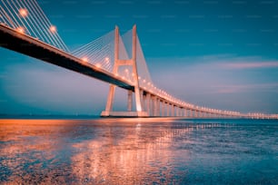 sunrise on Vasco da Gama bridge in Lisbon, Portugal