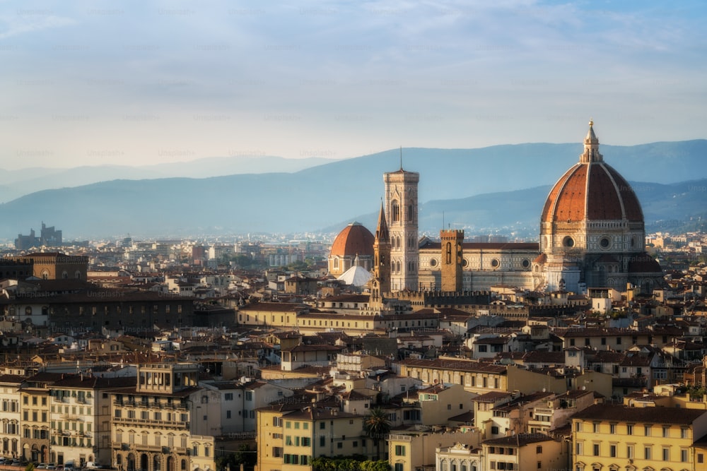 Florence Cathedral (Cattedrale di Santa Maria del Fiore) in historic center of Florence, Italy with panoramic view of the city. Florence Cathedral is the major tourist attraction of Tuscany, Italy.