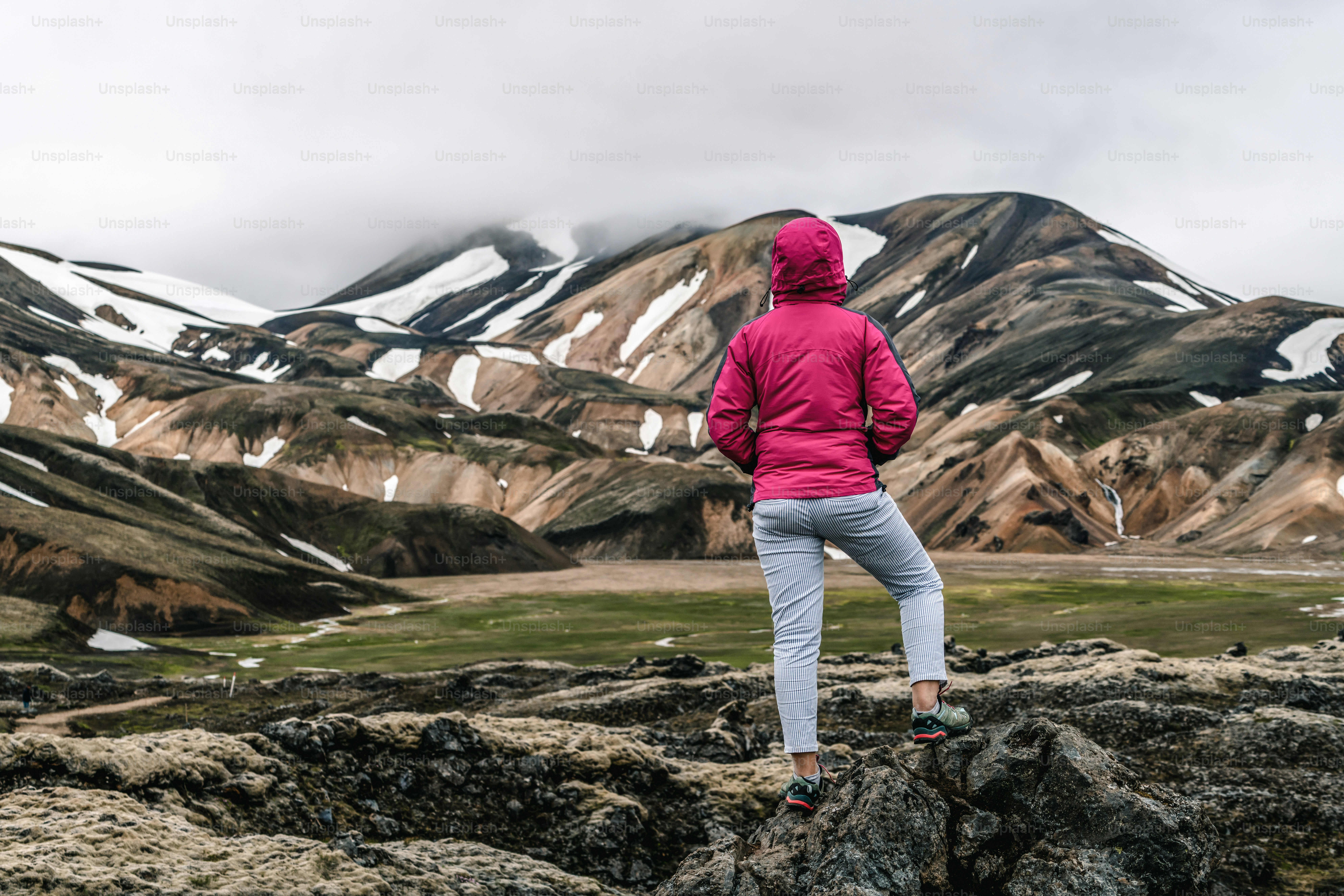 Traveler hiking at Landmannalaugar surreal nature landscape in highland