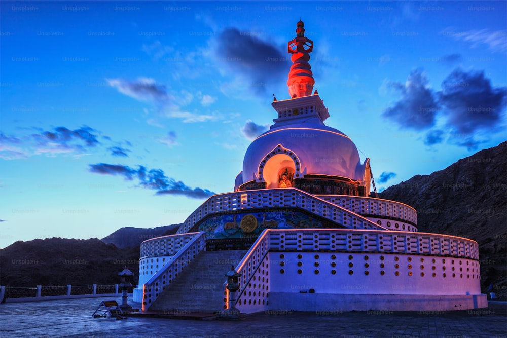 Shanti stupa illuminated in the evening twilight. Leh, Ladakh, Jammu and Kashmir, India