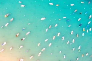 Boats in the harbor of Mediterranean fishing village, aerial view