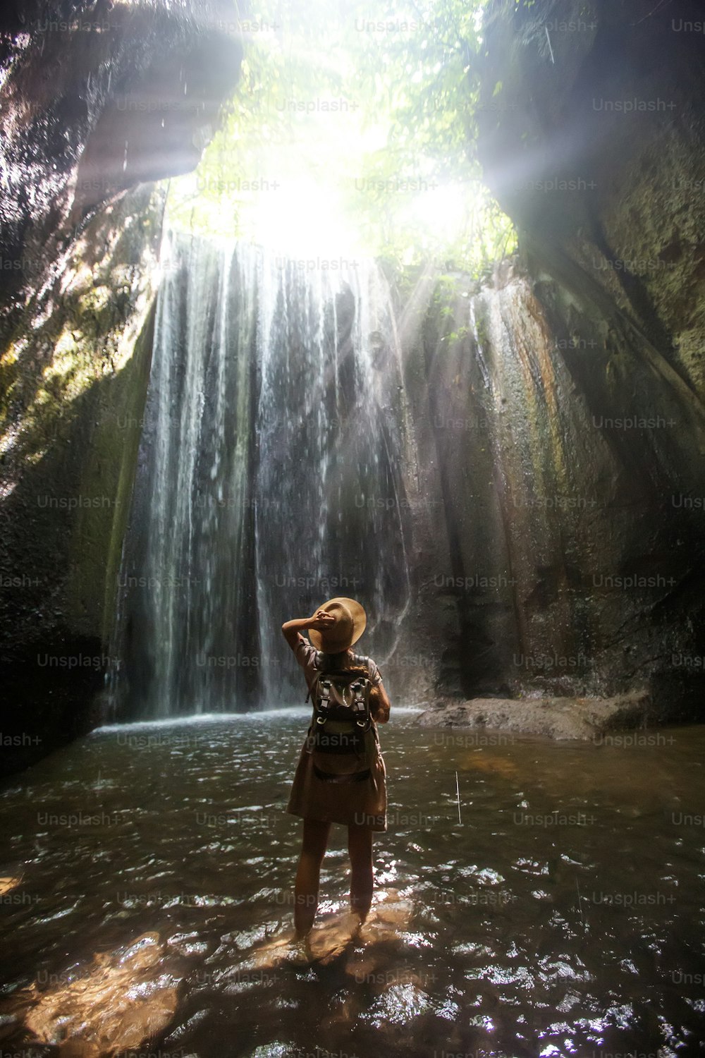 Woman near waterfal on Bali, IndonesiaÂ