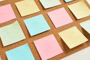 Cork board with pinned colored blank notes