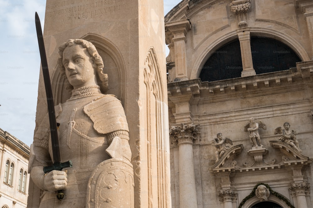 Detailed view of The Orlando's Column and St Blaise Church, the protector of Dubrovnik in the center of old town of Dubrovnik, Croatia. Dubrovnik old town was listed as UNESCO World Heritage Site.