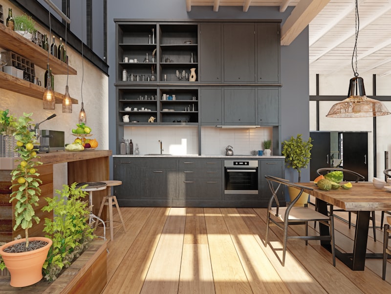 Kitchen with navy cabinets that coordinate with blue accents in adjacent living room