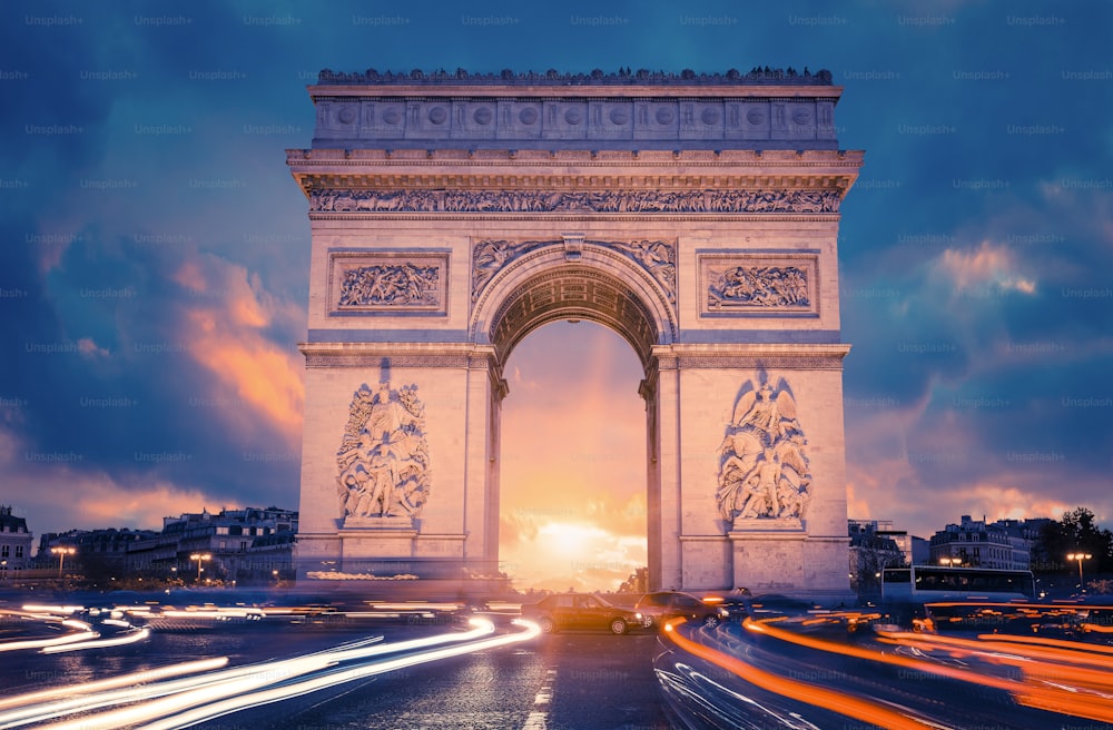 View of famous Arc de Triomphe at sunset, Paris