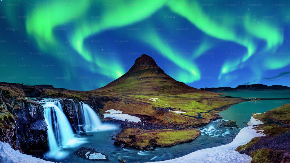Northern Light, Aurora borealis at Kirkjufell in Iceland. Kirkjufell mountains in winter.