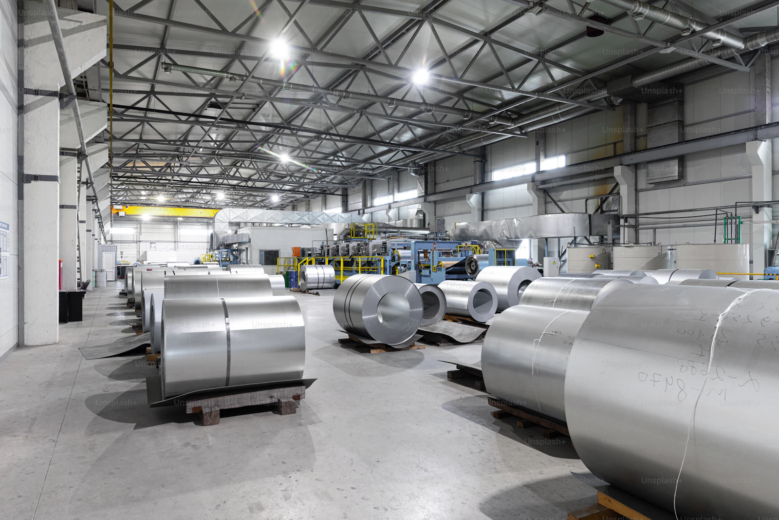 Rolled steel coil close-up showing material quality and tolerance