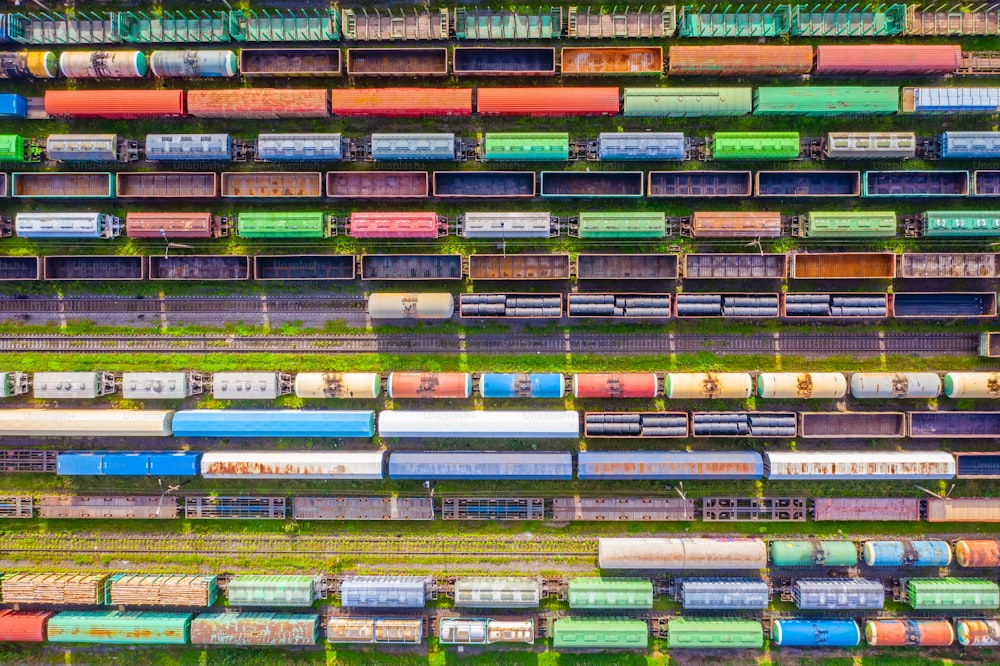 Freight trains made up of multi-colored wagons, aerial view