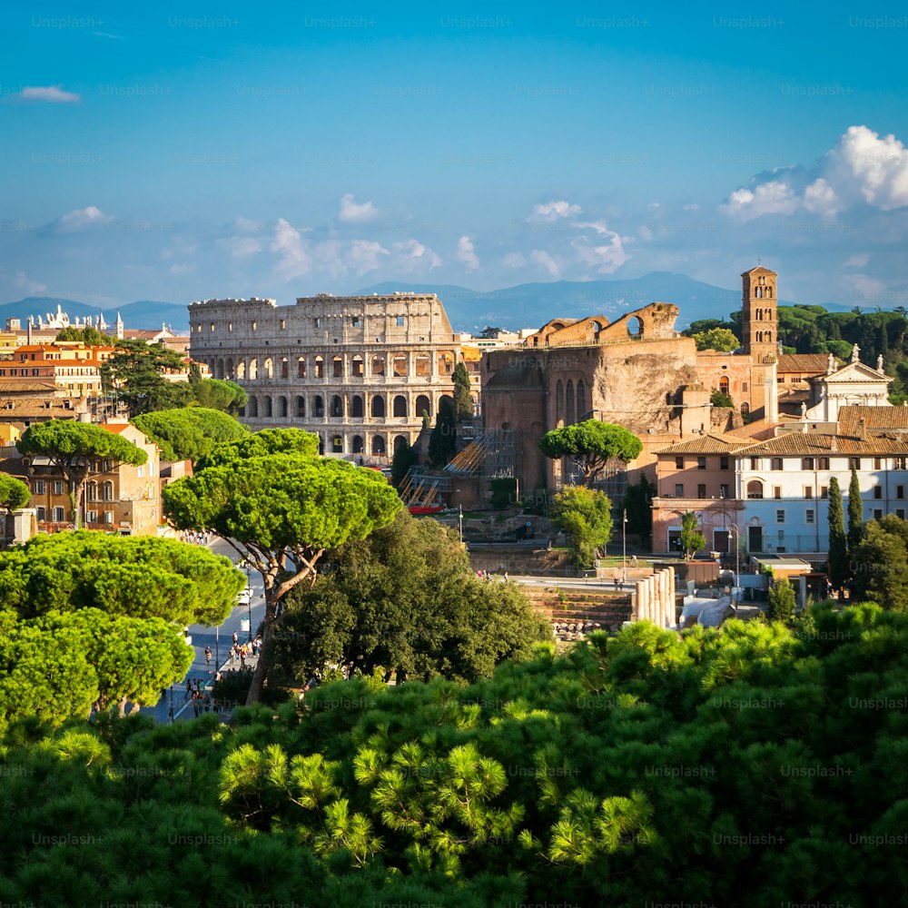 Rome, Italy city skyline with landmarks of the Ancient Rome ; Colosseum and Roman Forum, the famous travel destination of Italy.