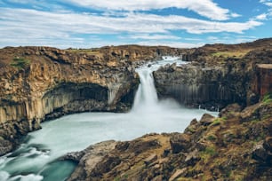 Icelandic summer landscape of the Aldeyjarfoss waterfall in north Iceland. The waterfall is situated in the northern part of the Sprengisandur Road within the Highlands of Iceland.