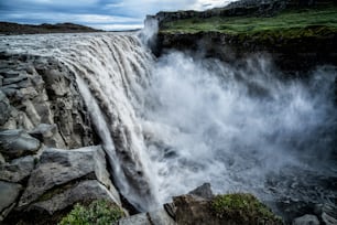 Amazing Iceland landscape at Dettifoss waterfall in Northeast Iceland region. Dettifoss is a waterfall in Vatnajokull National Park reputed to be the most powerful waterfall in Europe.