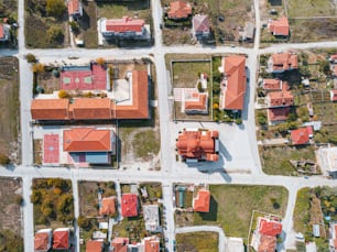 Aerial drone view above the traditional red roof tops of a resort town or village. The concept of real estate and travel in Europe