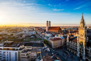 Aerial view of Munich - Marienplatz, Neues Rathaus and Frauenkirche from St. Peter's church on sunset. Munich, Germany