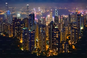 Famous view of Hong Kong - Hong Kong skyscrapers skyline cityscape view from Victoria Peak illuminated in the evening blue hour. Hong Kong, China