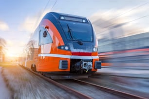 Suburban electric train on a blurred motion background