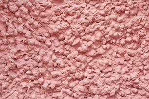 Fond abstrait rose. Mur avec texture de plâtre décoratif