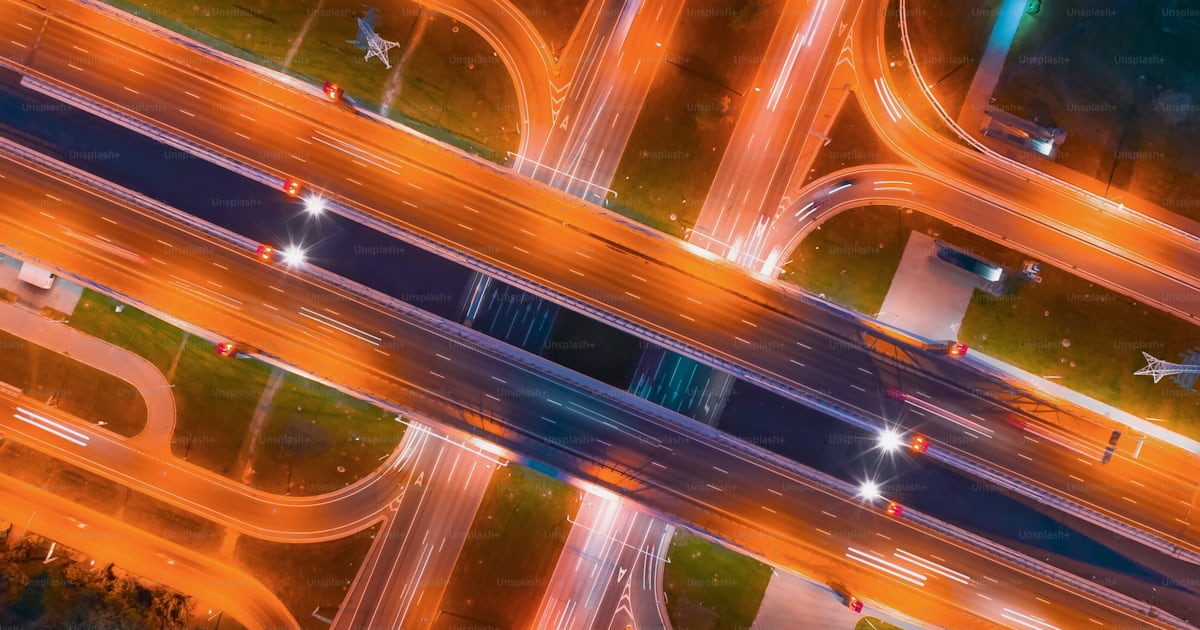 Intersection of two major highways, intersection under a bridge, night ...