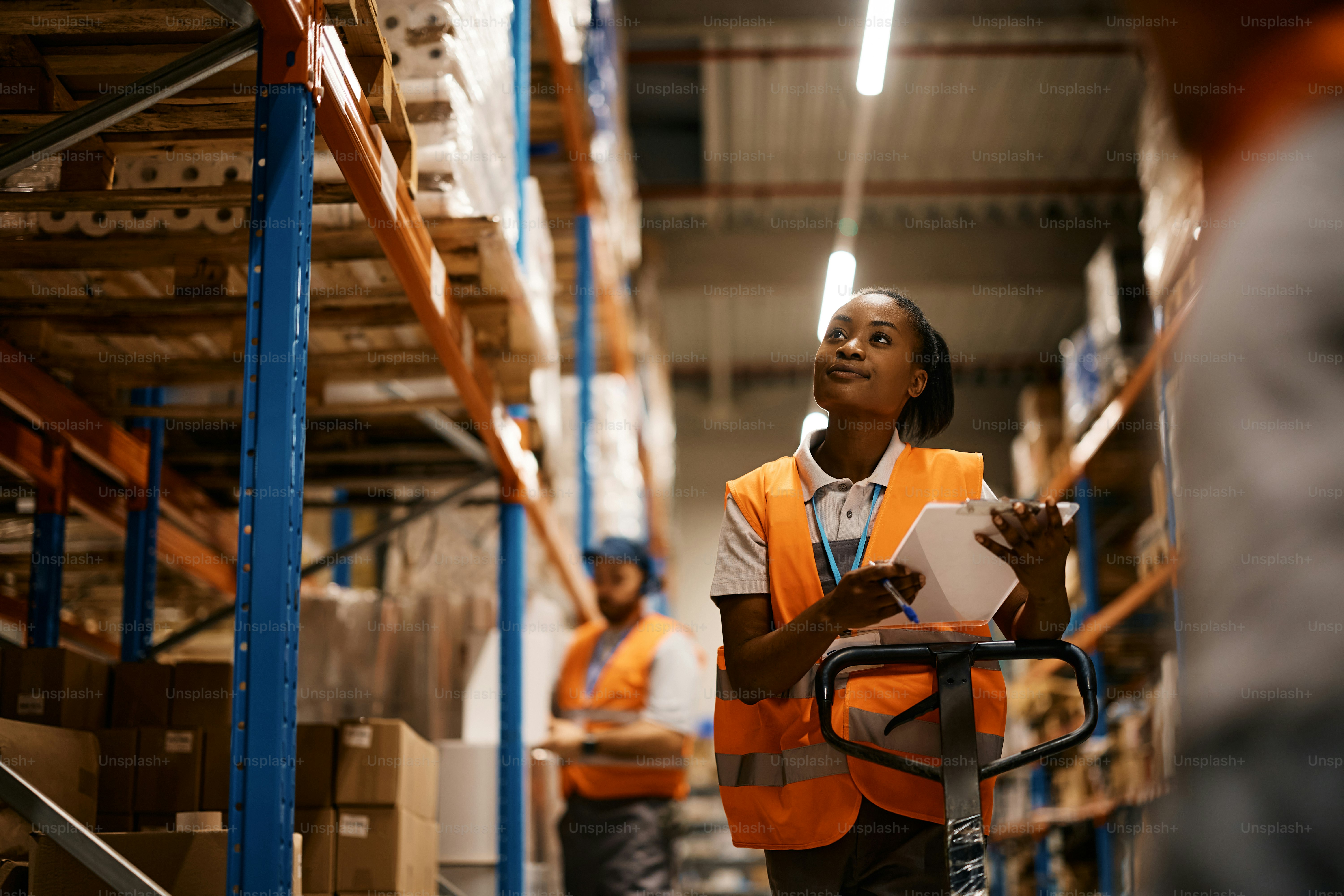 Team reviewing ethical sourcing ecommerce supply chain documents in a warehouse