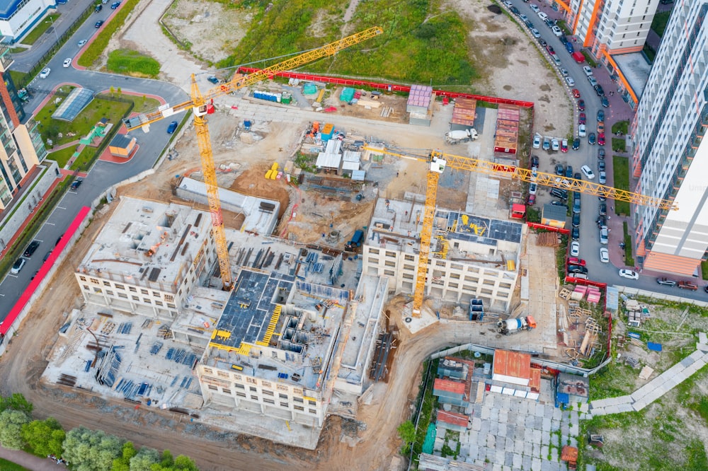 Aerial view of the beginning of the construction of the house, lower floors. Construction crane