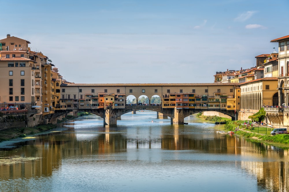 Florence Ponte Vecchio Bridge and City Skyline in Italy. Florence is capital city of the Tuscany region of central Italy. Florence was center of Italy medieval trade and wealthiest cities of past era.