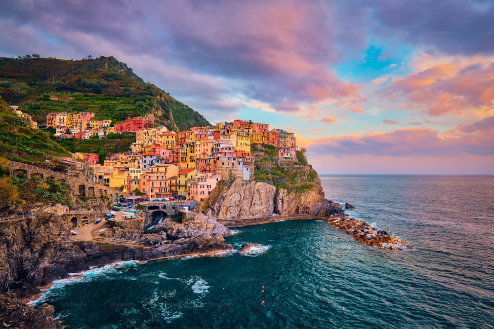 Manarola village popular european italian tourist destination in Cinque Terre National Park UNESCO World Heritage Site, Liguria, Italy on sunset