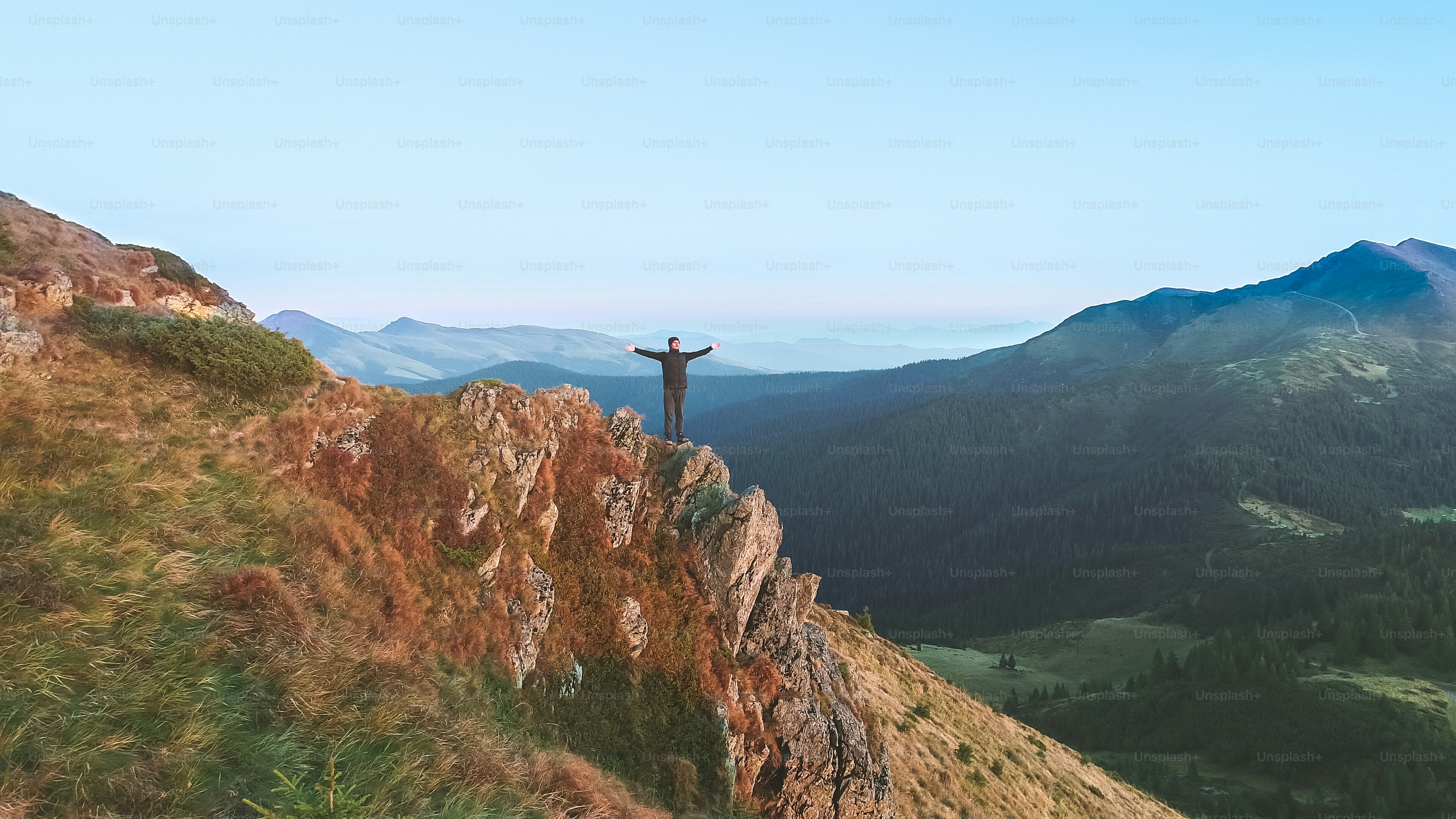 The happy man standing on the rock
